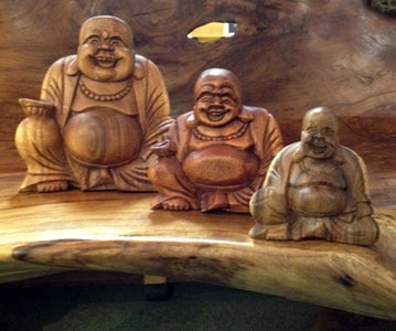 Carved happy Buddhas