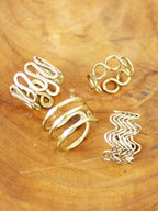 Gold adjustable wire rings – close-up of the four designs