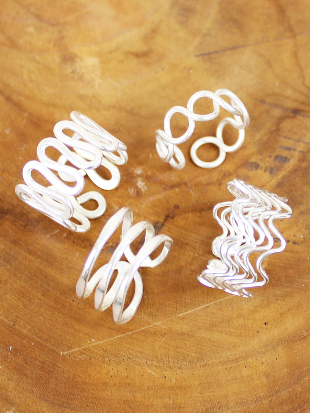 Silver adjustable wire rings – close-up of the four designs