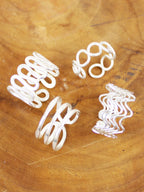 Silver adjustable wire rings – close-up of the four designs