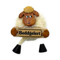 Pom pom sheep fridge magnet holding a Beddgelert plaque