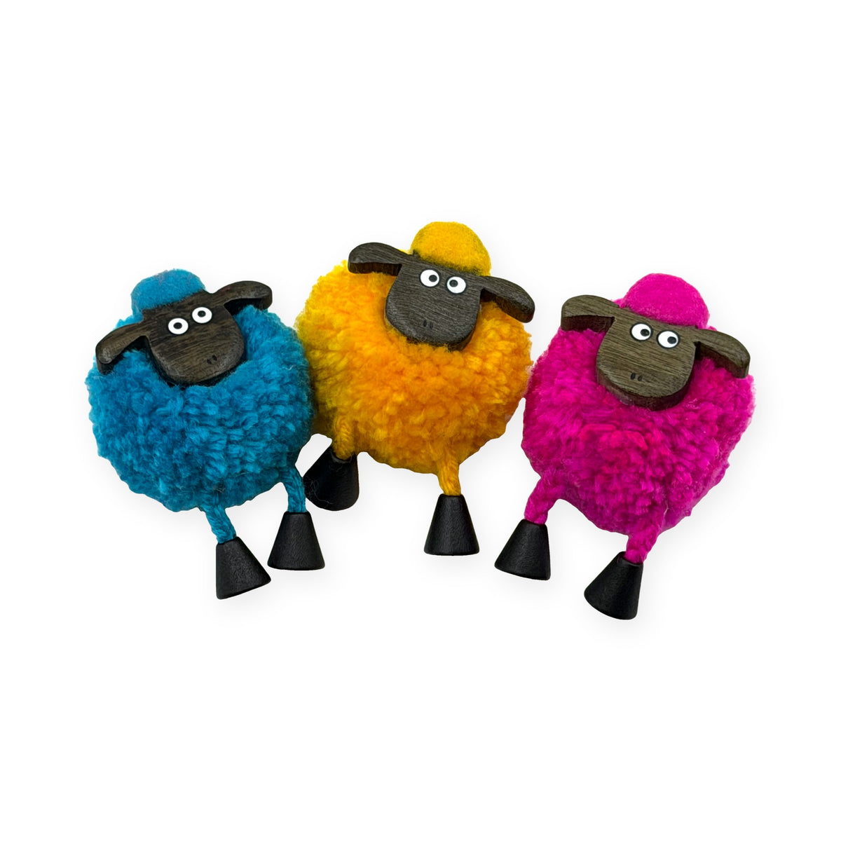 Pom pom sheep fridge magnets in blue, yellow and pink